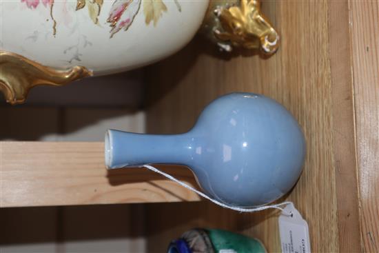 A Chinese blue glazed bottle vase, Kangxi mark but Republic period and a Chinese pottery figure tallest 12cm